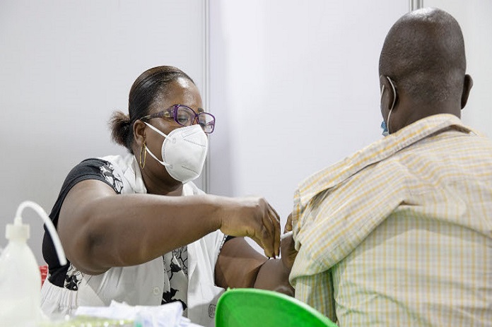 A man being vaccinated against COVID-19 at the vaccination cente